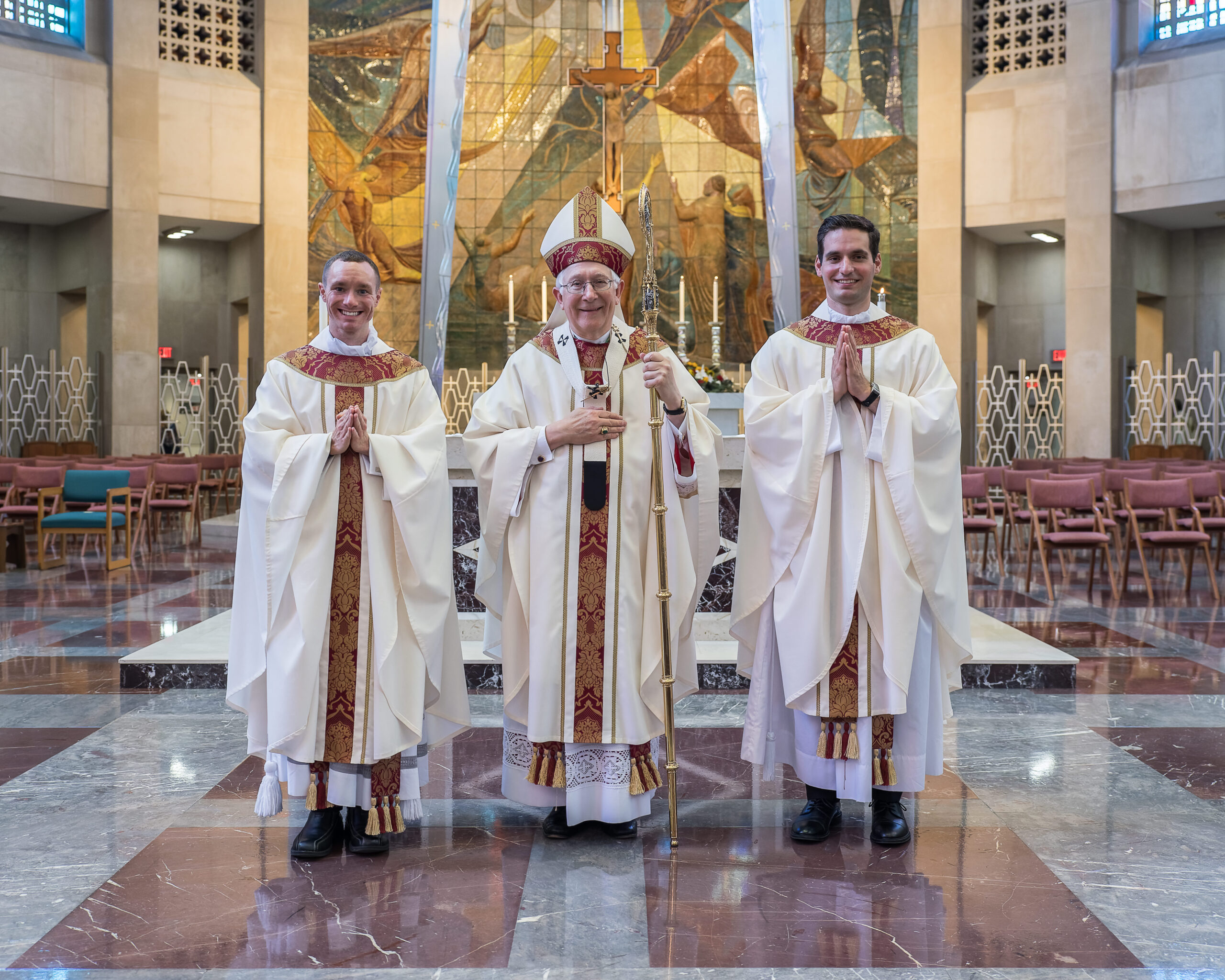 Archbishop Leonard P. Blair is flanked by two new priests for the Archdiocese of Hartford, Father Matthew Collins, left, and Father Joseph MacNeill, right, who were ordained June 26 at the Cathedral of St. Joseph in Hartford. Photo by Aaron Joseph